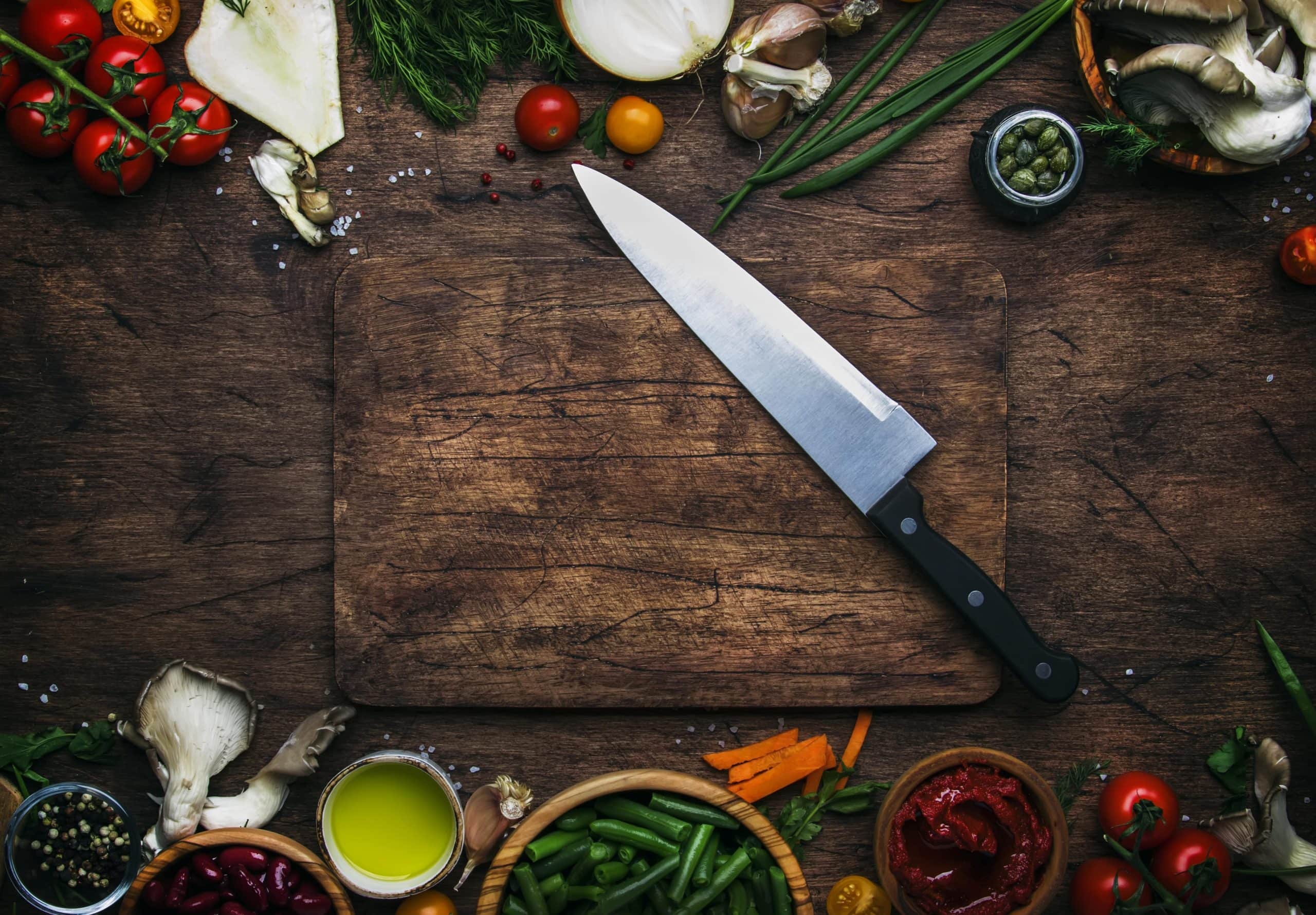 Best chef knife on a cutting board with ingredients