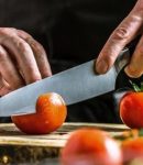 Cutting tomatoes with a chef knife