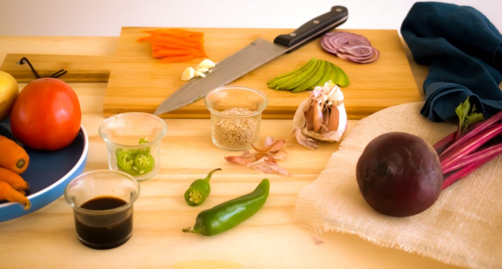 Japanese Chef Knife on a cutting board with ingredients