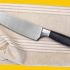 Chef-knife-on-a-kitchen-towel-scaled