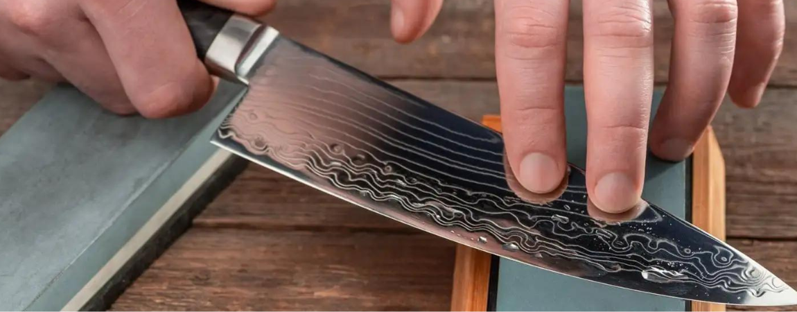 Man-sharpening-a-Damascus-chef-knife (2)
