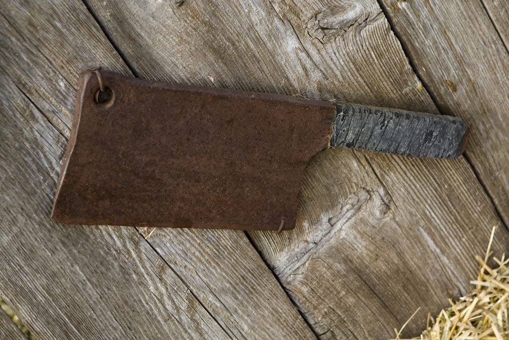 Cleaver hanging on a wall from its hole