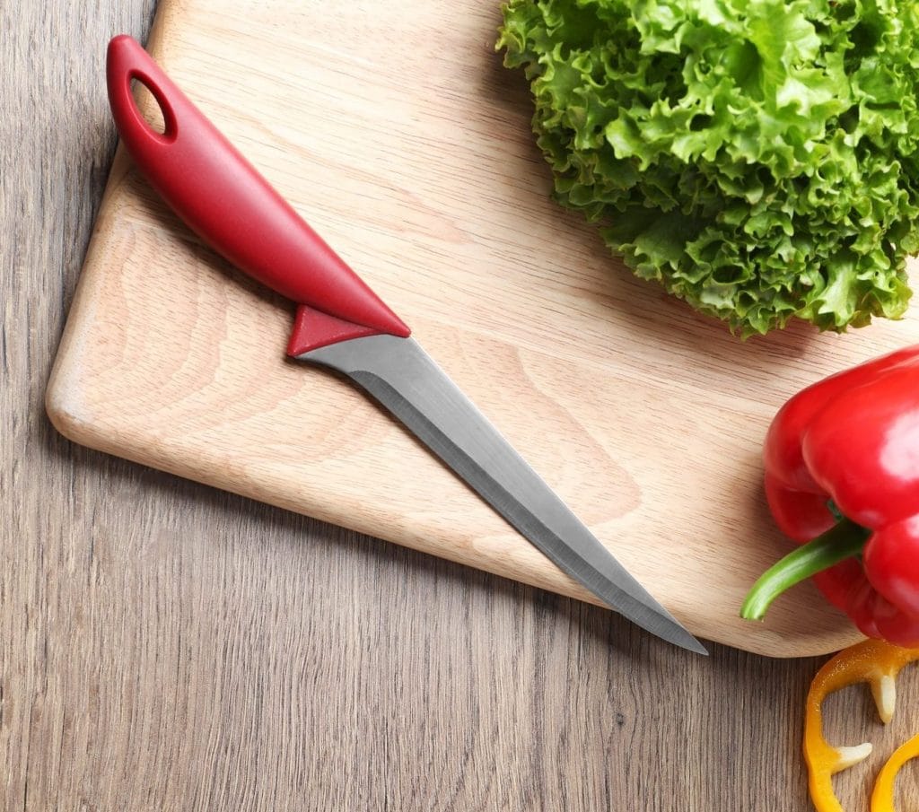 boning knife on a cuting board