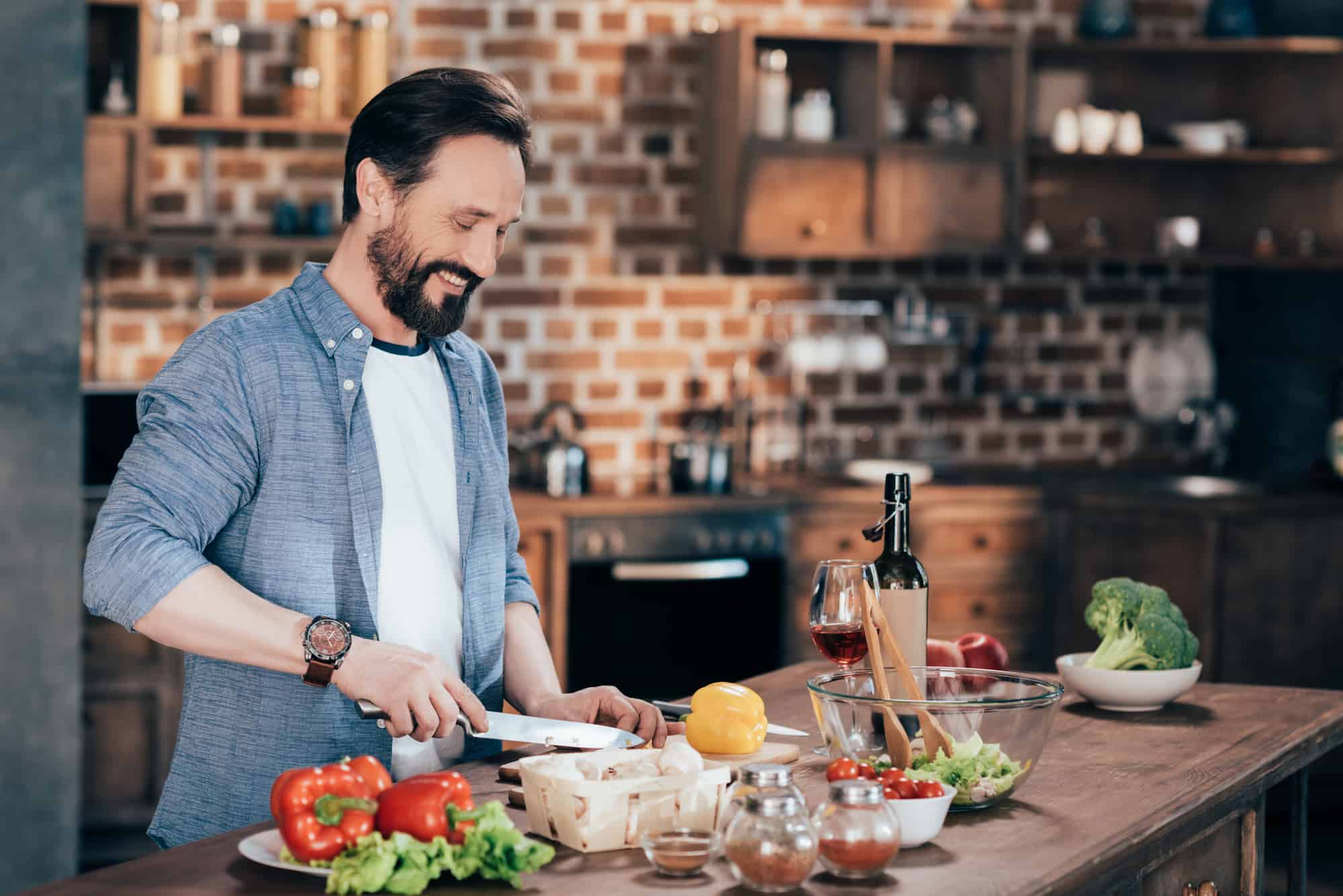 Man cooking vegetable salad