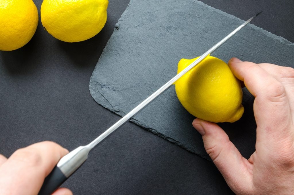 Person-Slicing-Lemon-scale