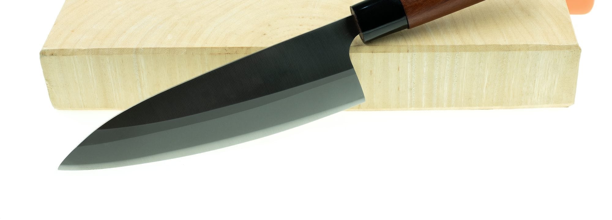 kitchen knife and wood butcher block countertop