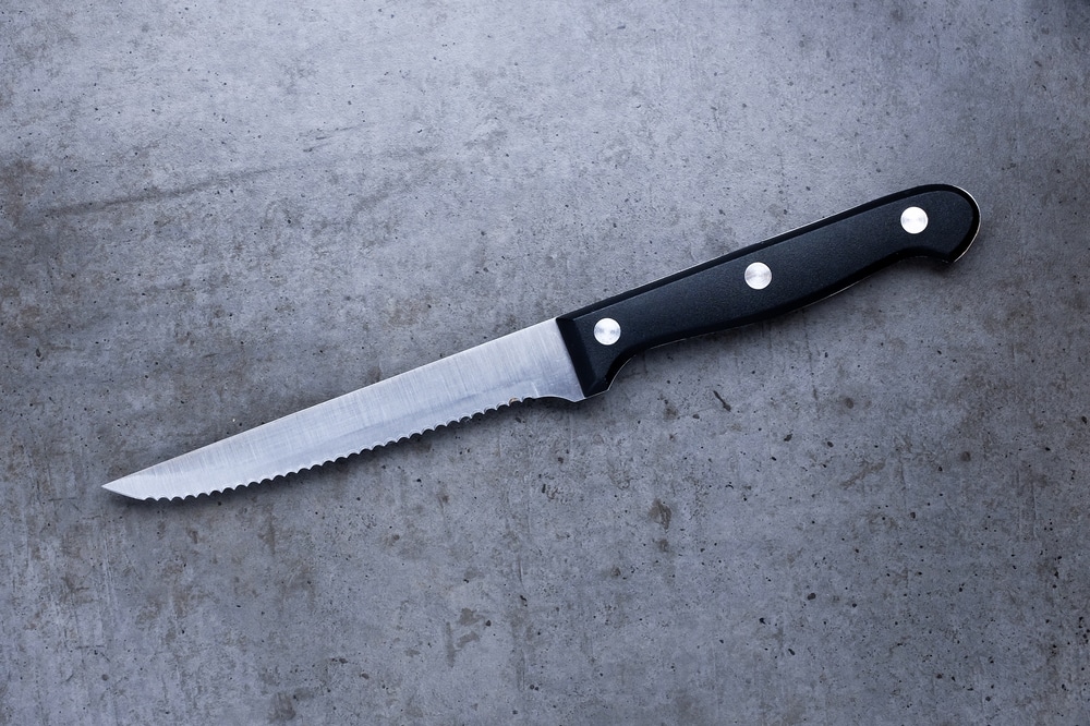 Serrated Knife On A Dark Gray Table — Photo 