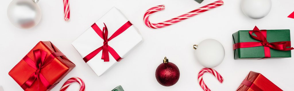 Website header of gift boxes, christmas balls and c