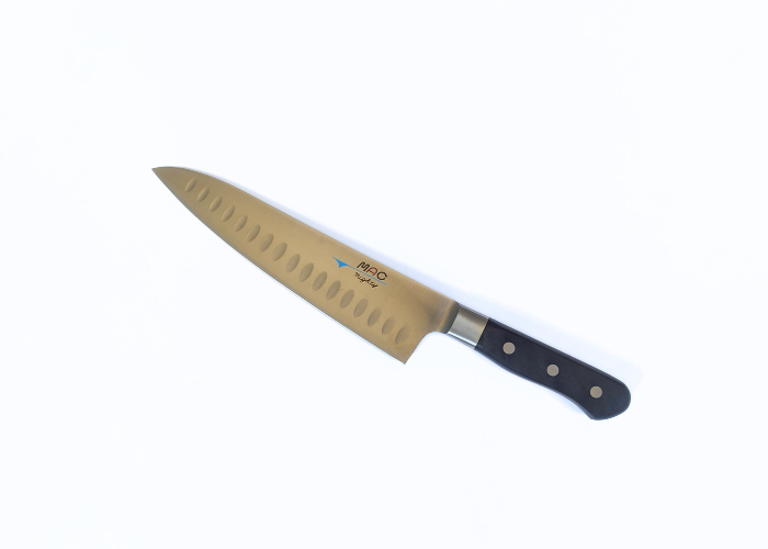 The Mac Professional 8 Inch Hollow Edge Chef Knife, diagonal on a white background