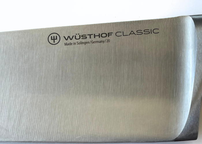 The wusthof classic 8 inch extra wide, horizontal on a white background