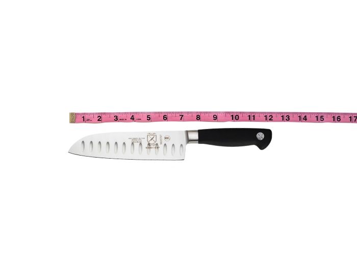 The Mercer, horizontal on a white background while measured with a pink ruler at